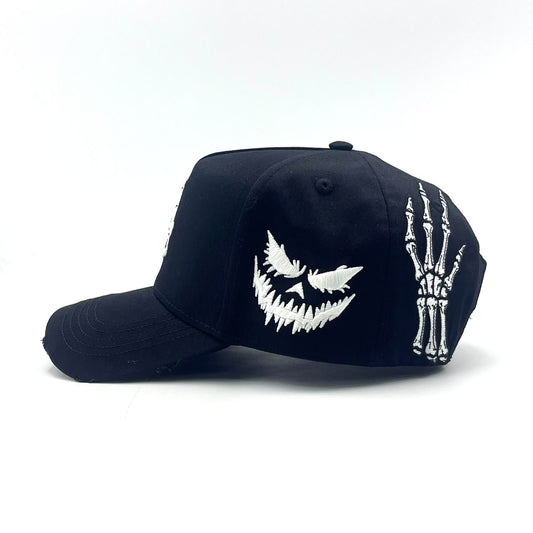 Become Again Skeleton hat, side — grin and skeleton hand